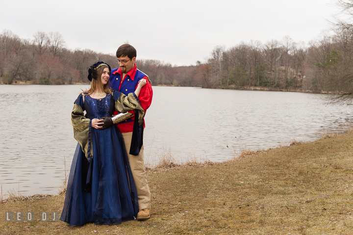 Engaged couple posing by a lake. Renaissance Costume Cosplay fun theme pre-wedding engagement photo session at Maryland, by wedding photographers of Leo Dj Photography. http://leodjphoto.com