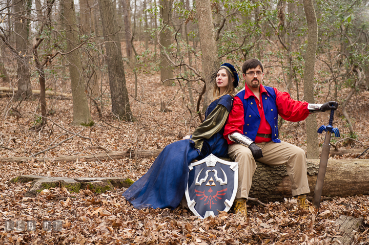 Engaged guy and his fiancée holding Zelda sword and shield. Renaissance Costume Cosplay fun theme pre-wedding engagement photo session at Maryland, by wedding photographers of Leo Dj Photography. http://leodjphoto.com