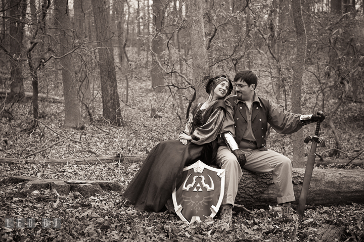 Engaged guy laughing together with his fiancée. Renaissance Costume Cosplay fun theme pre-wedding engagement photo session at Maryland, by wedding photographers of Leo Dj Photography. http://leodjphoto.com
