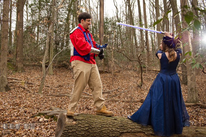 Engaged guy playing Zelda sword and fighting his fiancée who's using a light saber. Renaissance Costume Cosplay fun theme pre-wedding engagement photo session at Maryland, by wedding photographers of Leo Dj Photography. http://leodjphoto.com