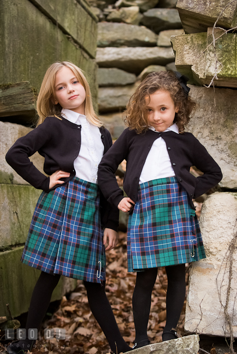 Two girls posing by building ruins. Washington DC fun and candid children lifestyle photo session of Helena and Vivian by photographers of Leo Dj Photography.