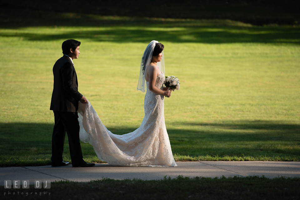 Hidden Creek Country Club Groom holding Bride's dress train photo by Leo Dj Photography