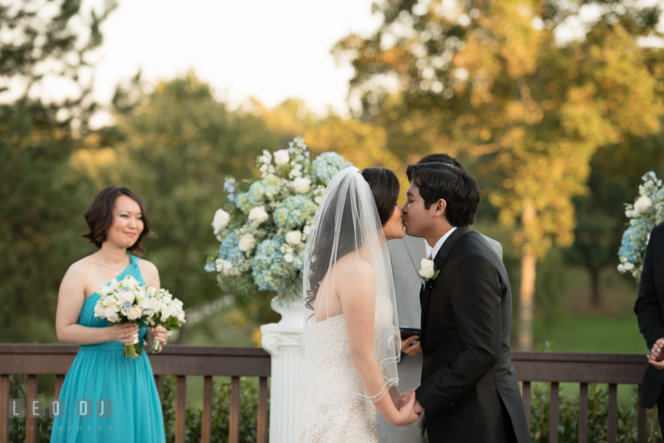 Reston Virginia Wedding Groom kissing Bride during ceremony photo by Leo Dj Photography