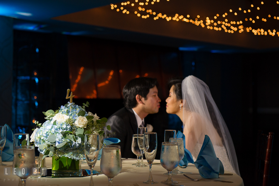 Hidden Creek Country Club Bride and Groom almost kissing by the dining table photo by Leo Dj Photography