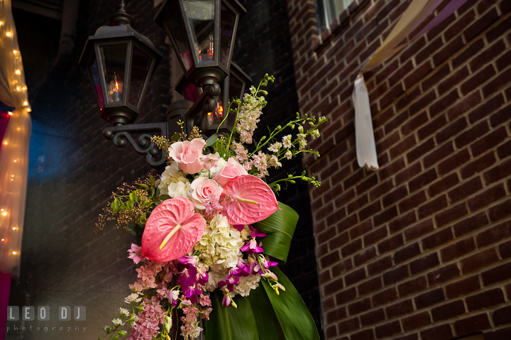 Pink rose, purple orchid and white hydrangea on lamp post. Historic Inns of Annapolis wedding bridal fair photos at Calvert House by photographers of Leo Dj Photography. http://leodjphoto.com