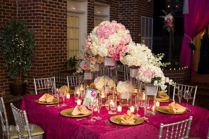 Table centerpiece decorations with white and pink hydrangea flower and roses. Historic Inns of Annapolis wedding bridal fair photos at Calvert House by photographers of Leo Dj Photography. http://leodjphoto.com