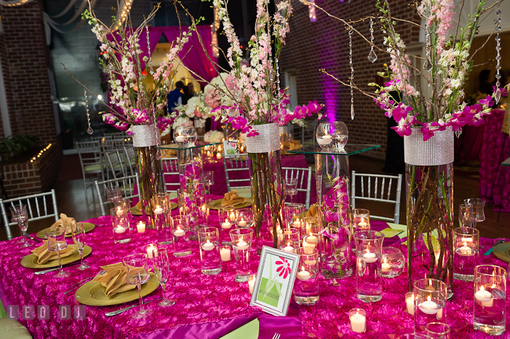 Tall centerpieces with white, pink and purple floral set with silver and transparent beads. Historic Inns of Annapolis wedding bridal fair photos at Calvert House by photographers of Leo Dj Photography. http://leodjphoto.com