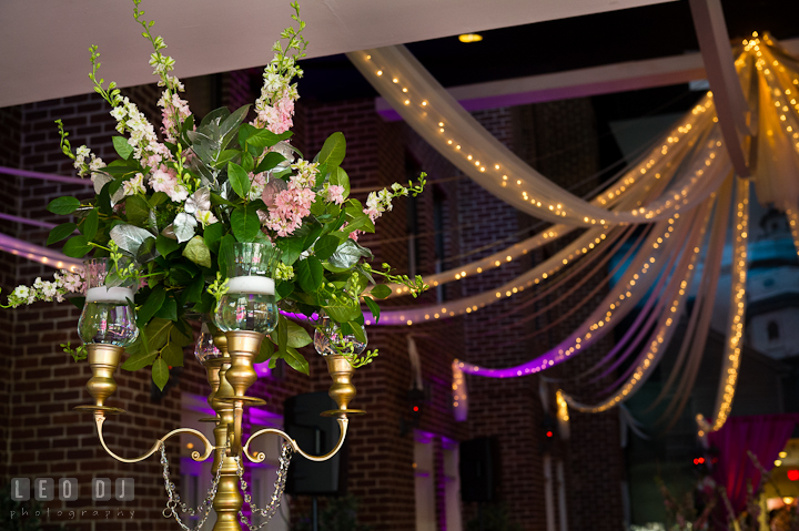 Table centerpiece with golden candlestick with tea lights and flowers. Historic Inns of Annapolis wedding bridal fair photos at Calvert House by photographers of Leo Dj Photography. http://leodjphoto.com