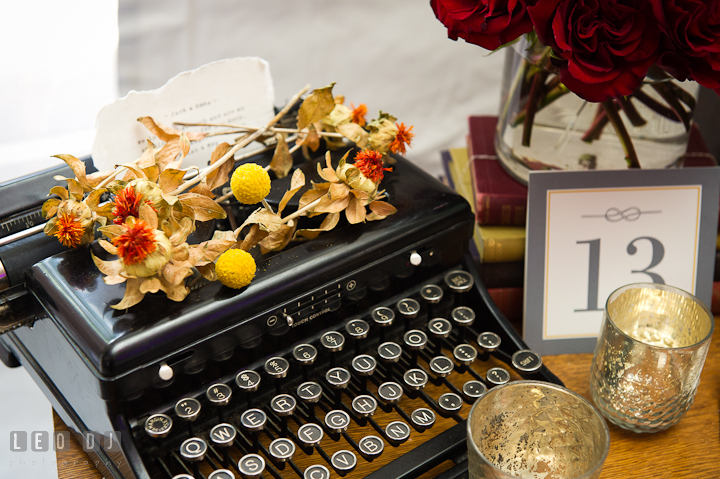 Old typewriter and dried flowers decor. Historic Inns of Annapolis wedding bridal fair photos at Calvert House by photographers of Leo Dj Photography. http://leodjphoto.com