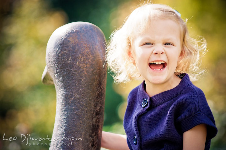 Little blonde girl laughing hard. Annapolis Maryland candid lifestyle family portrait photography