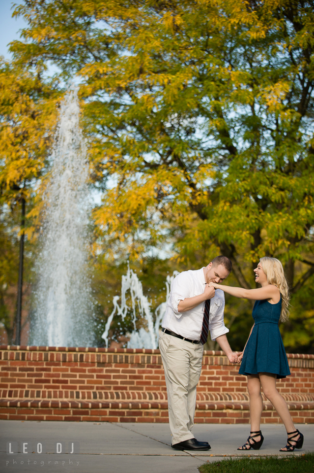 Engaged man kissed his fiancée's hand by the water fountain. Gettysburg PA pre-wedding engagement photo session, by wedding photographers of Leo Dj Photography. http://leodjphoto.com