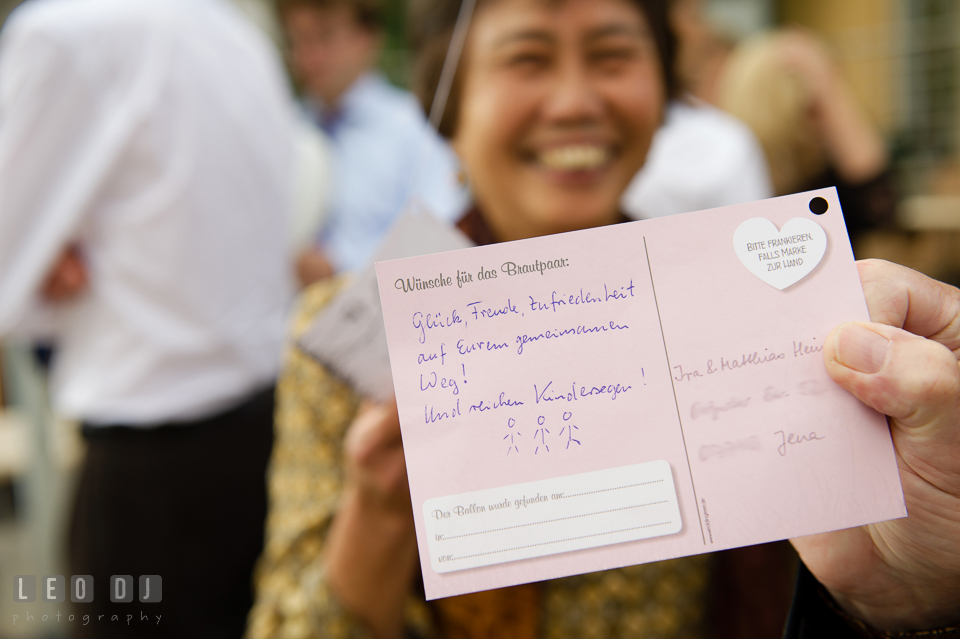 Aunt of the Bride with the postcard written for the newlyweds. Landgrafen Restaurant, Jena, Germany, wedding reception and ceremony photo, by wedding photographers of Leo Dj Photography. http://leodjphoto.com