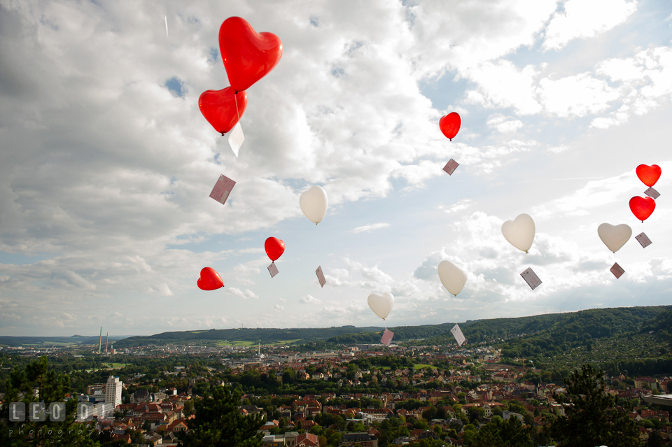 Heart-shaped balloons in the sky with written postcards for the Bride and Groom. Landgrafen Restaurant, Jena, Germany, wedding reception and ceremony photo, by wedding photographers of Leo Dj Photography. http://leodjphoto.com