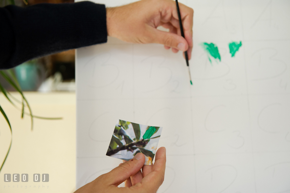 Guest painting on a canvas during wedding reception. Landgrafen Restaurant, Jena, Germany, wedding reception and ceremony photo, by wedding photographers of Leo Dj Photography. http://leodjphoto.com