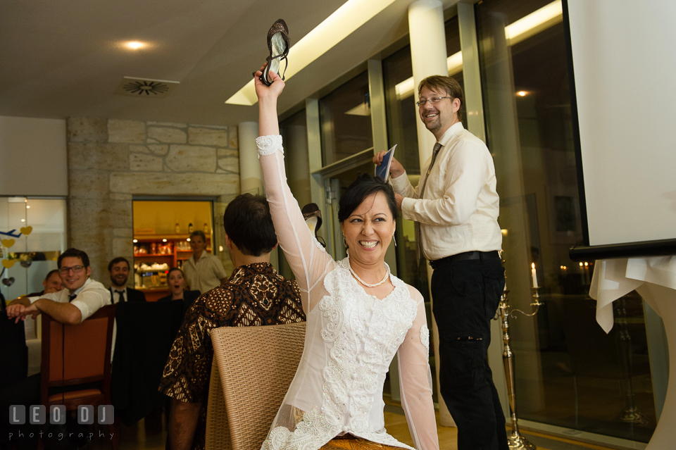 The Bride and Groom getting pranked by their friends doing the shoe games. Landgrafen Restaurant, Jena, Germany, wedding reception and ceremony photo, by wedding photographers of Leo Dj Photography. http://leodjphoto.com