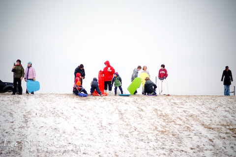 Children playing sled at K-Mart Stevensville Park and Ride during snow day