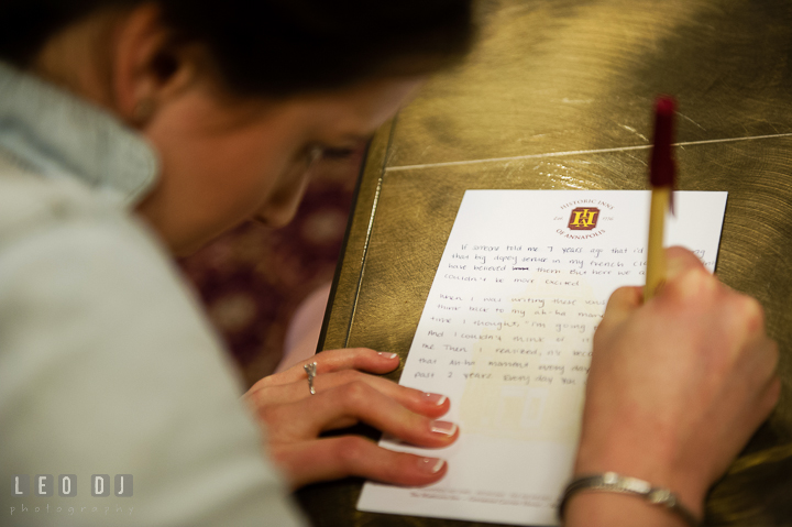 Bride writing vow for ceremony. Historic Inns of Annapolis, Governor Calvert House wedding Maryland, by wedding photographers of Leo Dj Photography. http://leodjphoto.com