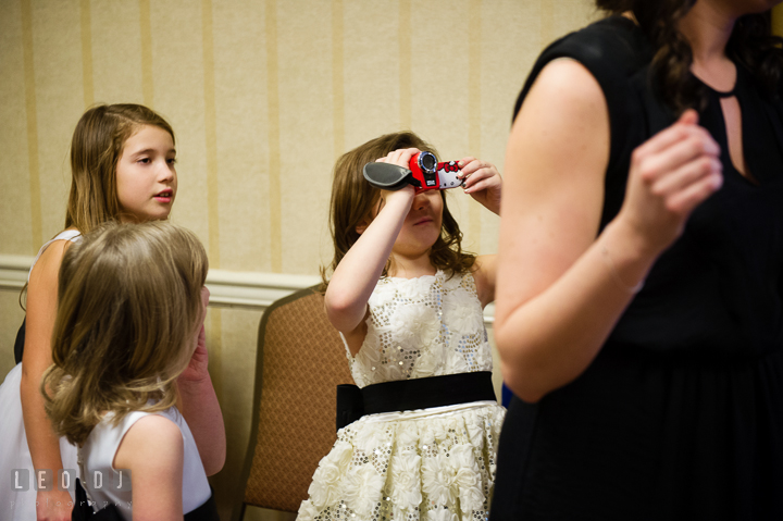 Flower girl trying to take video of Bride getting ready. Historic Inns of Annapolis, Governor Calvert House wedding Maryland, by wedding photographers of Leo Dj Photography. http://leodjphoto.com