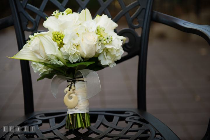 Bride's white flower bouquet attached with her late Grandmother's necklace. Historic Inns of Annapolis, Governor Calvert House wedding Maryland, by wedding photographers of Leo Dj Photography. http://leodjphoto.com