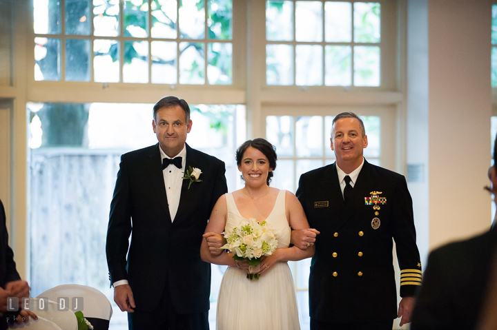 Bride walking down the aisle during procession, escorted by both of her Uncles. Historic Inns of Annapolis, Governor Calvert House wedding Maryland, by wedding photographers of Leo Dj Photography. http://leodjphoto.com