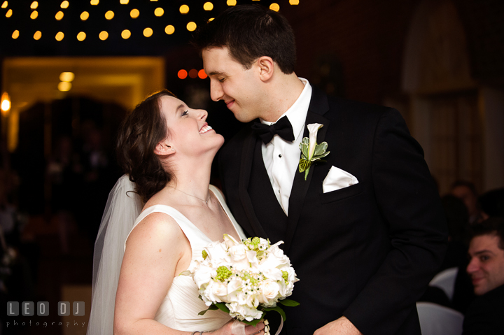 Bride and Groom trying to kiss during the recessional. Historic Inns of Annapolis, Governor Calvert House wedding Maryland, by wedding photographers of Leo Dj Photography. http://leodjphoto.com