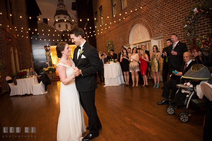 First dance of Bride and Groom with guests in the background. Historic Inns of Annapolis, Governor Calvert House wedding Maryland, by wedding photographers of Leo Dj Photography. http://leodjphoto.com