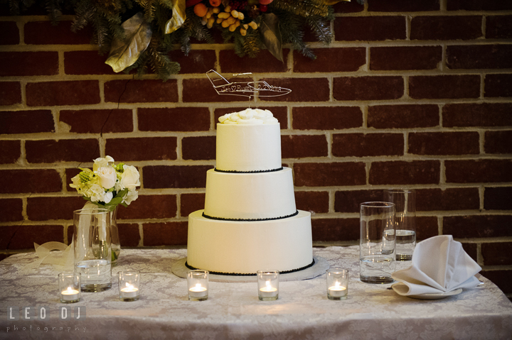 Wedding cake by Caroline's Cake with an airplane wireframe cake topper with the Bride and Groom's name and their wedding date. Historic Inns of Annapolis, Governor Calvert House wedding Maryland, by wedding photographers of Leo Dj Photography. http://leodjphoto.com