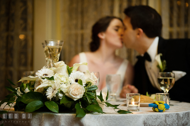 Bride and Groom kissing at the sweetheart table. Historic Inns of Annapolis, Governor Calvert House wedding Maryland, by wedding photographers of Leo Dj Photography. http://leodjphoto.com