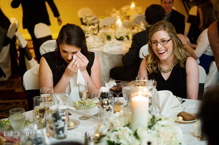 Bridesmaid and Maid of Honor laughing and got emotional listening to toast speech. Historic Inns of Annapolis, Governor Calvert House wedding Maryland, by wedding photographers of Leo Dj Photography. http://leodjphoto.com