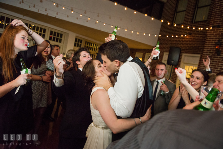 Bride and Groom kissing while dancing in a circle of their guests. Historic Inns of Annapolis, Governor Calvert House wedding Maryland, by wedding photographers of Leo Dj Photography. http://leodjphoto.com