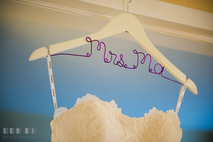 Wedding dress hanged on custom made hanger with last name. Falls Church Virginia 2941 Restaurant wedding ceremony photo, by wedding photographers of Leo Dj Photography. http://leodjphoto.com