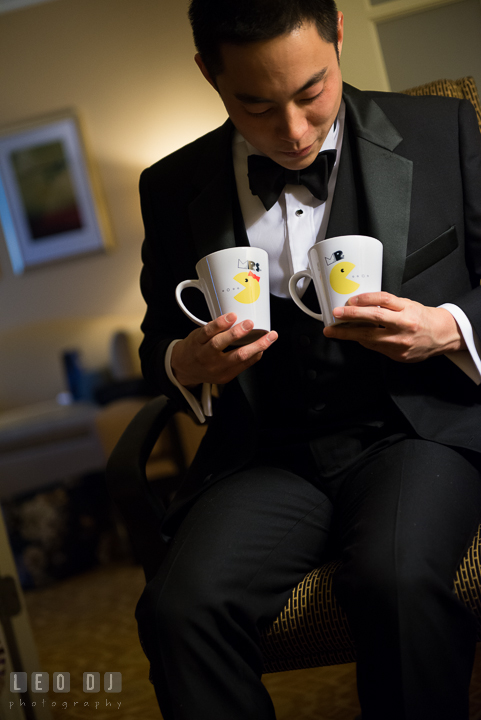 Groom holding gifts from Bride. Falls Church Virginia 2941 Restaurant wedding ceremony photo, by wedding photographers of Leo Dj Photography. http://leodjphoto.com