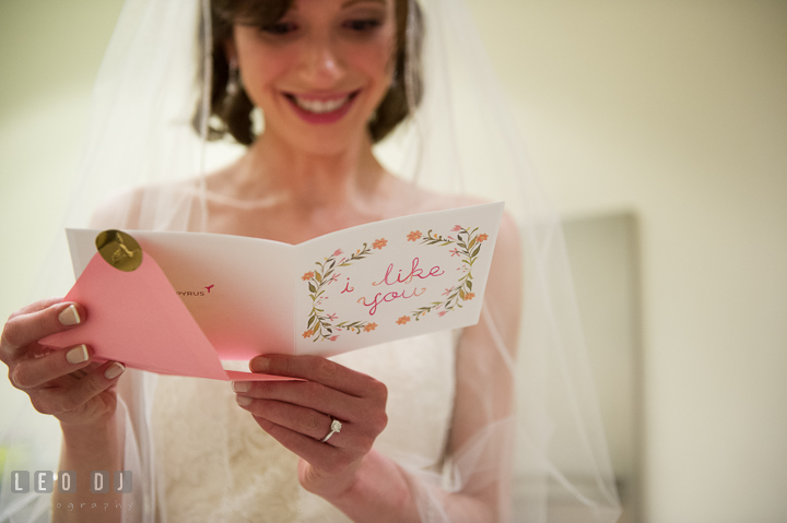 Bride opening and reading card from Groom. Falls Church Virginia 2941 Restaurant wedding ceremony photo, by wedding photographers of Leo Dj Photography. http://leodjphoto.com