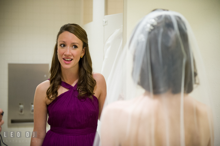 Maid of Honor talking to Bride. Falls Church Virginia 2941 Restaurant wedding ceremony photo, by wedding photographers of Leo Dj Photography. http://leodjphoto.com