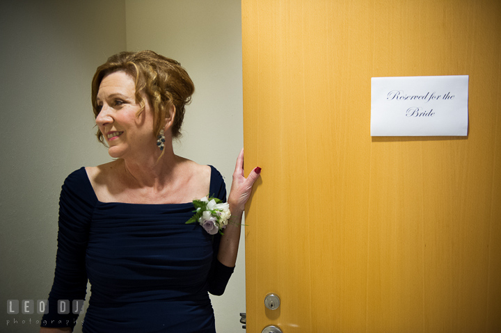 Mother of Bride holding the room door with sign Reserved for the Bride. Falls Church Virginia 2941 Restaurant wedding ceremony photo, by wedding photographers of Leo Dj Photography. http://leodjphoto.com