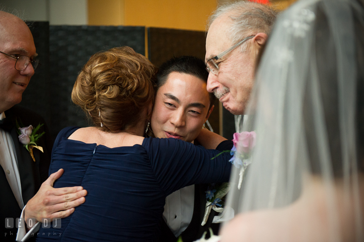 Mother of Bride hugging Groom. Falls Church Virginia 2941 Restaurant wedding ceremony photo, by wedding photographers of Leo Dj Photography. http://leodjphoto.com