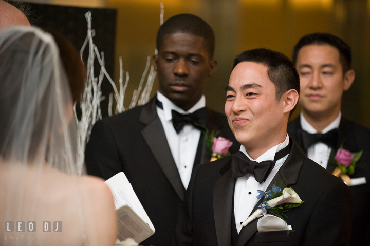 Groom smiling to Bride listening to her sweet and funny vow. Falls Church Virginia 2941 Restaurant wedding ceremony photo, by wedding photographers of Leo Dj Photography. http://leodjphoto.com