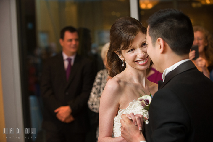 Bride smiling to Groom while performing first dance. Falls Church Virginia 2941 Restaurant wedding reception photo, by wedding photographers of Leo Dj Photography. http://leodjphoto.com