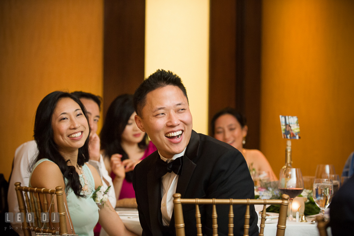 Groom's sister and Brother in Law laughing listening to Best Man's speech. Falls Church Virginia 2941 Restaurant wedding reception photo, by wedding photographers of Leo Dj Photography. http://leodjphoto.com