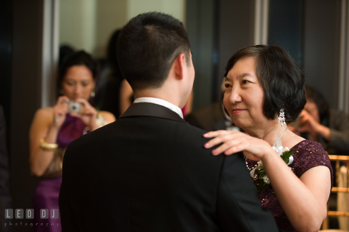 Mother of Groom smiled to son during parent dance. Falls Church Virginia 2941 Restaurant wedding reception photo, by wedding photographers of Leo Dj Photography. http://leodjphoto.com