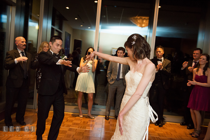 Bride and Groom having fun dancing on the dance floor. Falls Church Virginia 2941 Restaurant wedding reception photo, by wedding photographers of Leo Dj Photography. http://leodjphoto.com