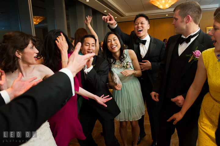 Bride and in-laws having fun singing and dancing. Falls Church Virginia 2941 Restaurant wedding reception photo, by wedding photographers of Leo Dj Photography. http://leodjphoto.com