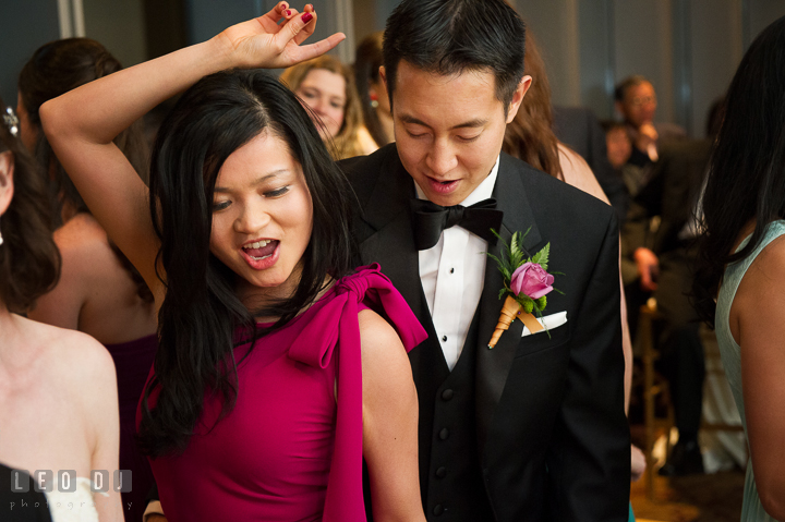 Groom's brother and sister-in-law dancing. Falls Church Virginia 2941 Restaurant wedding reception photo, by wedding photographers of Leo Dj Photography. http://leodjphoto.com