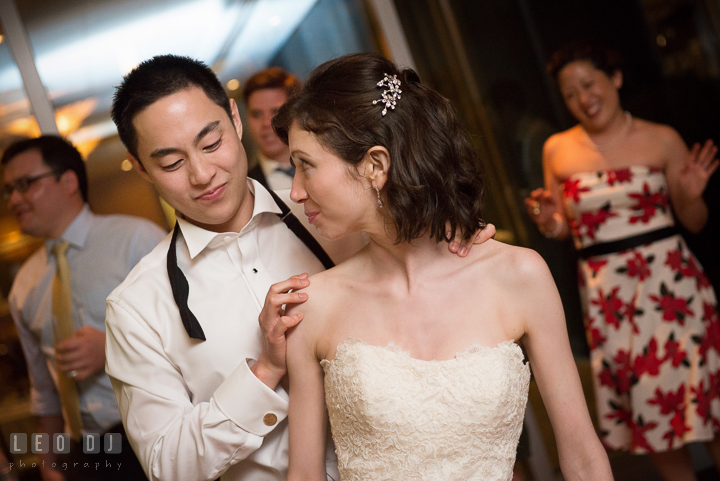 Bride and Groom smiling and dancing together. Falls Church Virginia 2941 Restaurant wedding reception photo, by wedding photographers of Leo Dj Photography. http://leodjphoto.com