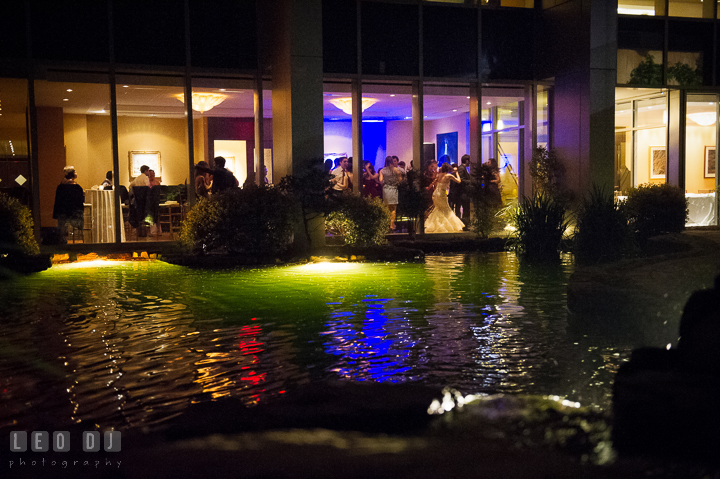 Outside view of the venue with the pond in the foreground. Falls Church Virginia 2941 Restaurant wedding reception photo, by wedding photographers of Leo Dj Photography. http://leodjphoto.com