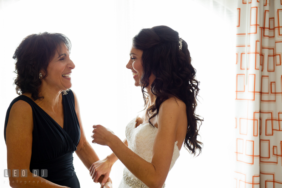 Mother of Bride and daughter laughing together during getting ready. Loews Annapolis Hotel Maryland wedding, by wedding photographers of Leo Dj Photography. http://leodjphoto.com