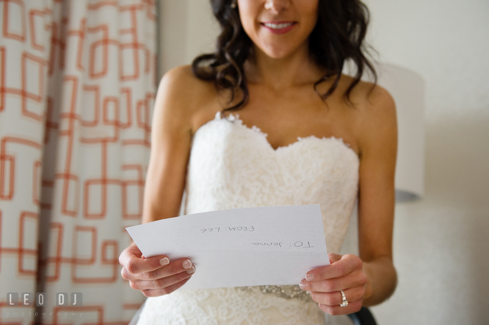 Bride reading letter from Groom during getting ready. Loews Annapolis Hotel Maryland wedding, by wedding photographers of Leo Dj Photography. http://leodjphoto.com