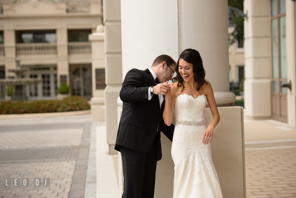 Groom checking out Bride's wedding gown during their first look. Loews Annapolis Hotel Maryland wedding, by wedding photographers of Leo Dj Photography. http://leodjphoto.com