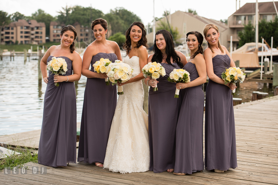 Bride posing with Maid of Honor and Bridesmaids with their bouquets. Loews Annapolis Hotel Maryland wedding, by wedding photographers of Leo Dj Photography. http://leodjphoto.com