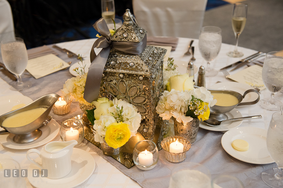 Table centerpiece of luxurious beaded lantern and flowers by Violets Florists by Connie Clark. Loews Annapolis Hotel Maryland wedding, by wedding photographers of Leo Dj Photography. http://leodjphoto.com